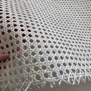 May include: White cane webbing, a woven material used for chair seats and backs, with a close-up view of the intricate weave pattern.