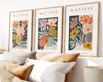May include: Three framed art prints with a minimalist design featuring colorful abstract flowers. The prints are titled "Matisse" and feature the text "Flowers Cut-Outs Art".