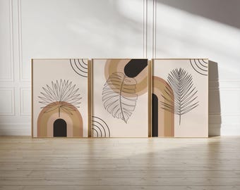 May include: Set of three abstract art prints featuring a minimalist design with brown and black arches and line drawings of palm leaves on a cream background.