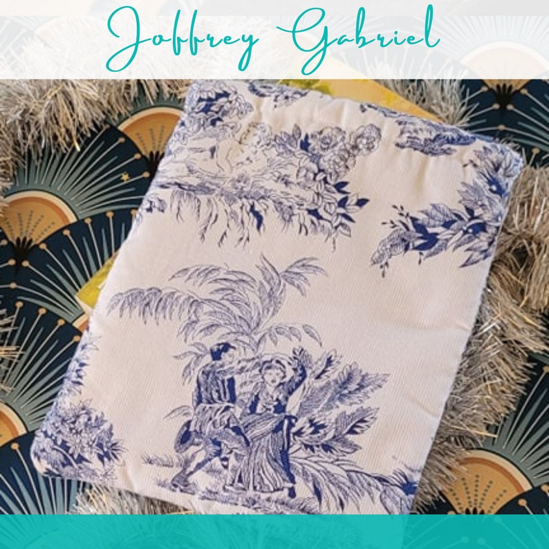 May include: A white fabric pouch with a blue and white floral pattern. The pouch features a design of two people dancing in a garden setting.