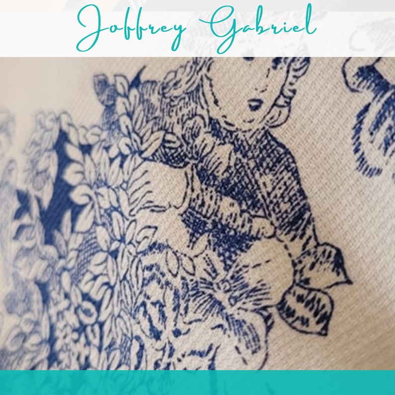 May include: A white fabric with a blue floral pattern. The pattern features a girl in a dress and a floral design.