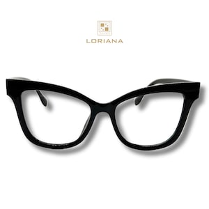 May include: Black cat-eye glasses with clear lenses. The glasses have a thick black frame and a slightly angled design.