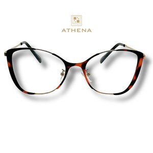 May include: Tortoise shell cat eye glasses with a gold metal frame.