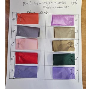 May include: A colour card for poly-lining fabric, with swatches in various colours. The card includes a range of hues, from red and pink to purple and green, with measurements in inches. The text "P0006 poly-lining (China style)" is visible.