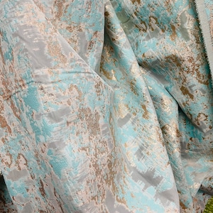 Champagne with tiffiny blue  organza jacquard brocade  great for dress skirt shirt pants and much more designer fabrics made in Italy
