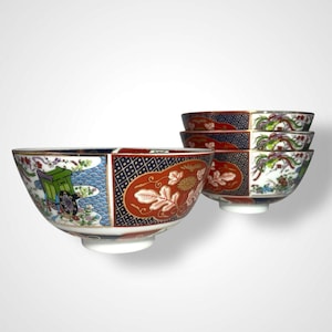 May include: Set of decorative ceramic bowls with a colorful, traditional Japanese design. The bowls feature a mix of red, blue, green, and gold patterns, including floral motifs and a landscape scene. The set includes four bowls.