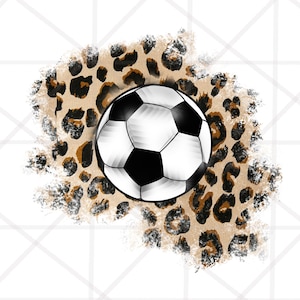 May include: A black and white soccer ball on a brown and black leopard print background.