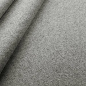 A detailed close-up of a light gray solid wool felt curtain, showcasing the high-quality 2mm thick premium felt texture. The soft, dense natural fiber material provides superior thermal insulation & energy-saving properties for cold winter months. Perfect for custom home decor, this durable gray wool fabric adds a minimalist and modern look to luxury window treatments. Ideal as sound-reducing drapes for a home office, dorm room, or designer bedroom, providing a sophisticated & cozy tactile feel.