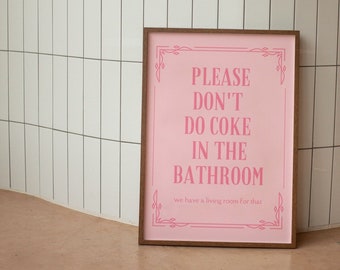 May include: A pink framed sign with the text "PLEASE DON'T DO COKE IN THE BATHROOM we have a living room for that".