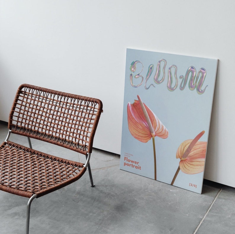 May include: A light blue poster with the word "bloom" in iridescent letters. Two pink flowers are on the poster, one on the left and one on the right. The poster is titled "Flower portrait" and has the number "[2/3]" in the bottom right corner.