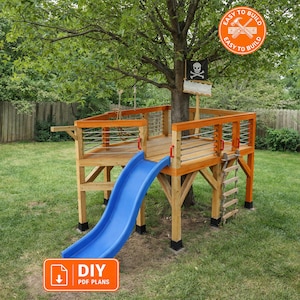 May include: A wooden treehouse platform built around a tree trunk featuring a blue plastic slide, a rope ladder, and railings with horizontal metal bars. A black pirate flag with a skull and crossbones is attached to the tree. Includes DIY PDF PLANS.