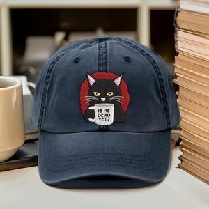 Is He Dead Yet Black Cat embroidered cap, Anti Trump Protest embroidered hat, Subtle FDT dad cap, Funny Political cap, Resist And Persist