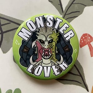 May include: A set of three ceramic mugs with a speckled, matte finish. The mugs are in shades of cream, light gray, and dark gray. Each mug has a simple, minimalist design, perfect for coffee or tea.