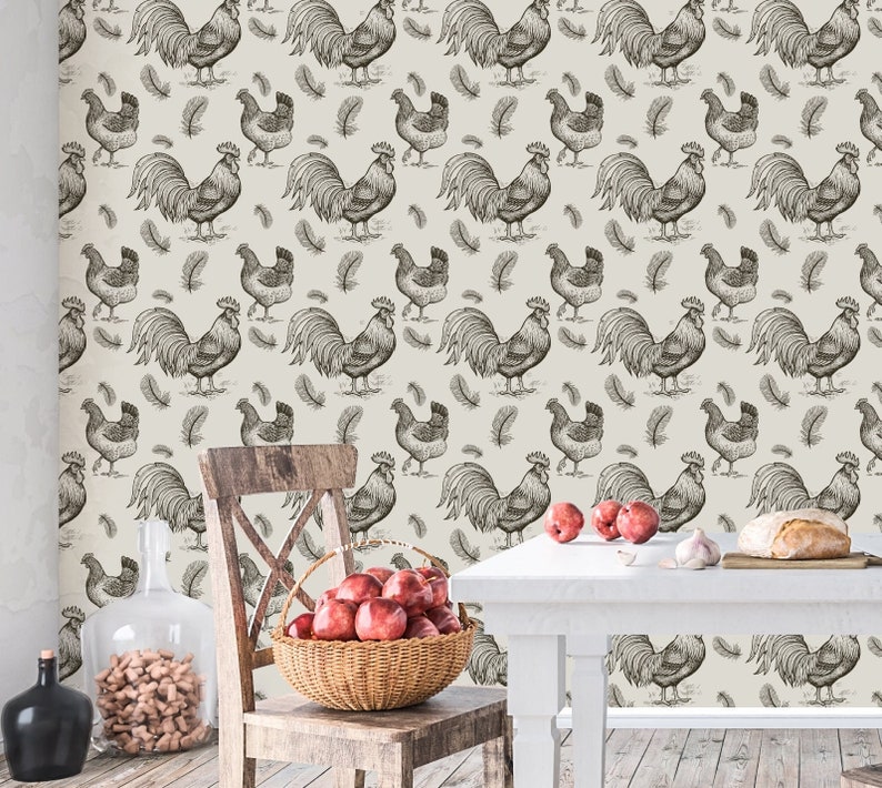 May include: A cream-colored wallpaper with a repeating pattern of black and white rooster illustrations. The roosters are drawn in a vintage style and are surrounded by small black feathers.