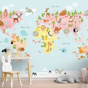 May include: A colorful world map with animals from different continents. The map is on a light blue background with white clouds. The continents are colored in pink, yellow, and green. The animals are drawn in a cartoon style and include a bear, deer, elephant, giraffe, zebra, lion, tiger, panda, kangaroo, and more.