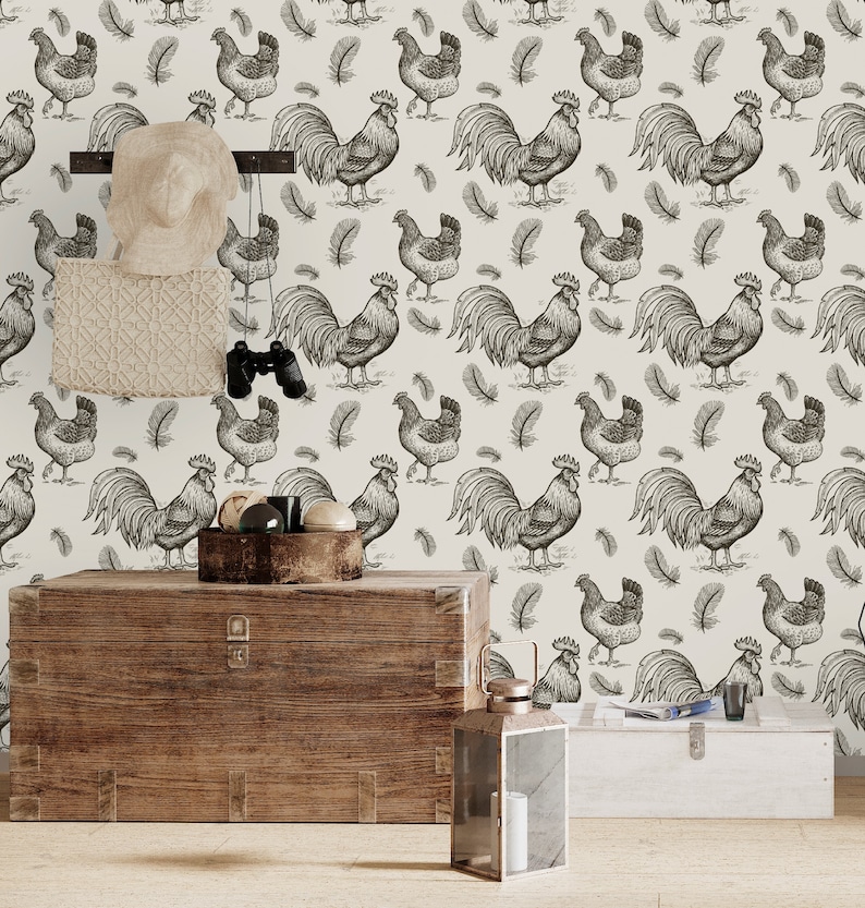 May include: A white background with a repeating pattern of black and white rooster and feather illustrations. A wooden chest and a lantern are in the foreground.