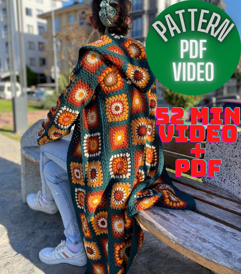 May include: A long, crocheted cardigan with a hood in a green, orange, and brown color scheme. The cardigan is made of granny squares with a floral pattern. The text "PATTERN PDF VIDEO 52 MIN VIDEO + PDF" is visible in the image.