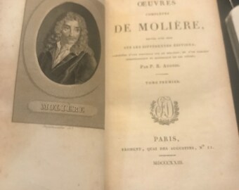 May include: A vintage book titled "OEUVRES DE MOLIÈRE" with a portrait of Molière on the cover. The book was published in Paris in 1823.