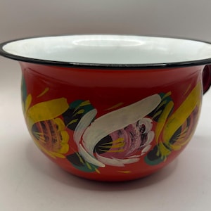 Polish enamelware chamber pot planter. Floral pattern on red glaze. Stamped Made in Poland 18. Toleware hand painted red floral decoration
