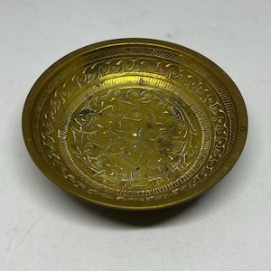 Decorative brass trinket dish ashtray. Hand stamped Made in BTSH INDIA  519 Unusual engraved 3.5 inches in diameter vintage brass dish.