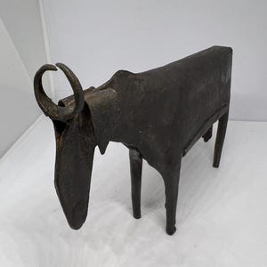Brutalist metal cow sculpture. Hand forged minimalist bovine figure. Iron abstract folk art figurine. Quirky horned metal heifer. MCM decor.