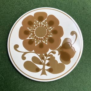 Vintage Jersey Pottery tea pot stand. Retro flower design ceramic trivet.