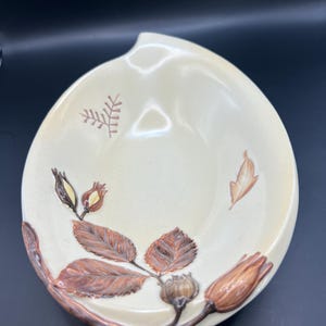 Vintage Carltonware decorative bowl. Cream glazed leaf shaped bowl with brown flower and leaf pattern. Approximately 9.5 inches long.