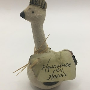 Quirky sitting bird with comb. Stone ware Studio pottery with original label. Handmade by Hafdis. Long necked bird ornament.