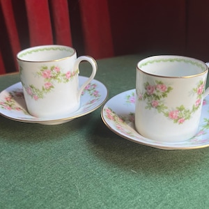 Set of 2 bone china Demitasse Tea coffee cups and matching saucers. Stamped A Lanternier & Co Limoges. Pink floral decorative tea cups.