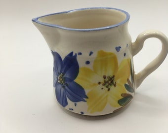 Ceramic milk cream jug. Hand painted with yellow and blue flowers.