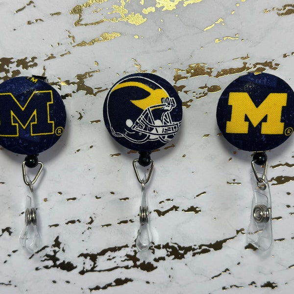 University of Michigan Badge Reel Buttons. U of M Wolverines Badge Buttons. Nurse Badge Buttons. Customizable and Interchangeable.