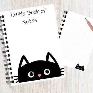 Notebook / Notepad with an image of a cute cat peering up from the bottom of each page. A Great gift for any cat lover. Can be personalised.