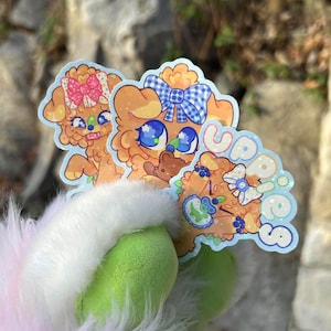 May include: A handmade, wooden cutting board with a natural finish. The board features a live edge and a juice groove. Dimensions are approximately 18 inches long, 12 inches wide, and 1 inch thick.