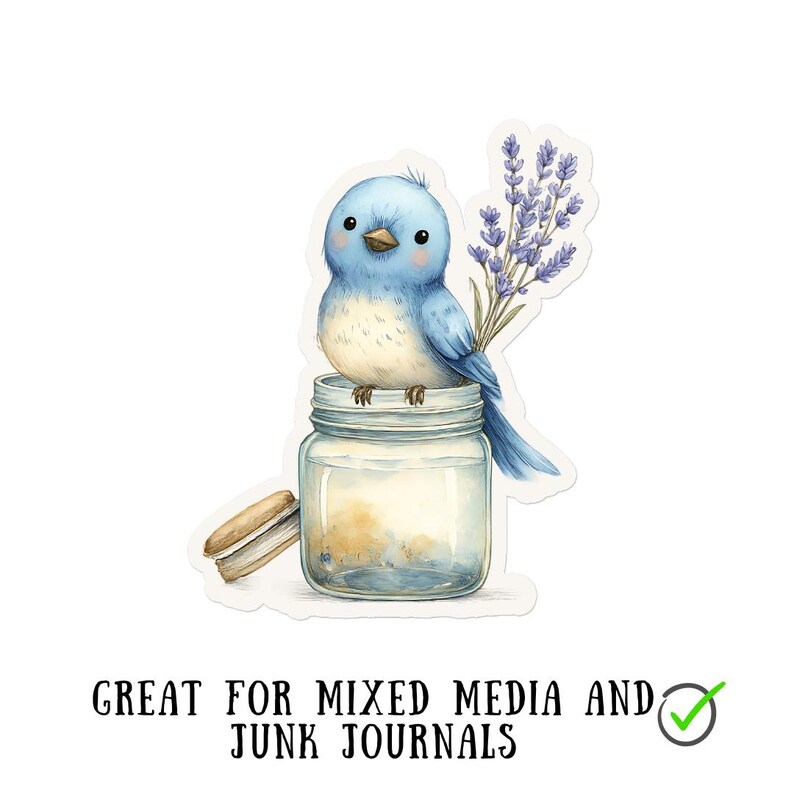 May include: A watercolor sticker featuring a bluebird perched on a glass jar, holding lavender sprigs. A small cookie rests beside the jar. The text "GREAT FOR MIXED MEDIA AND JUNK JOURNALS" is at the bottom.