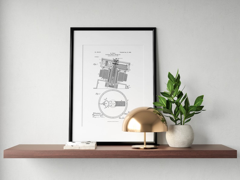 May include: A black framed print of a vintage patent drawing for a "Coupling for Electric Motors" hangs on a wall above a wooden shelf. A gold table lamp with a dome-shaped shade sits on the shelf next to a potted green plant.