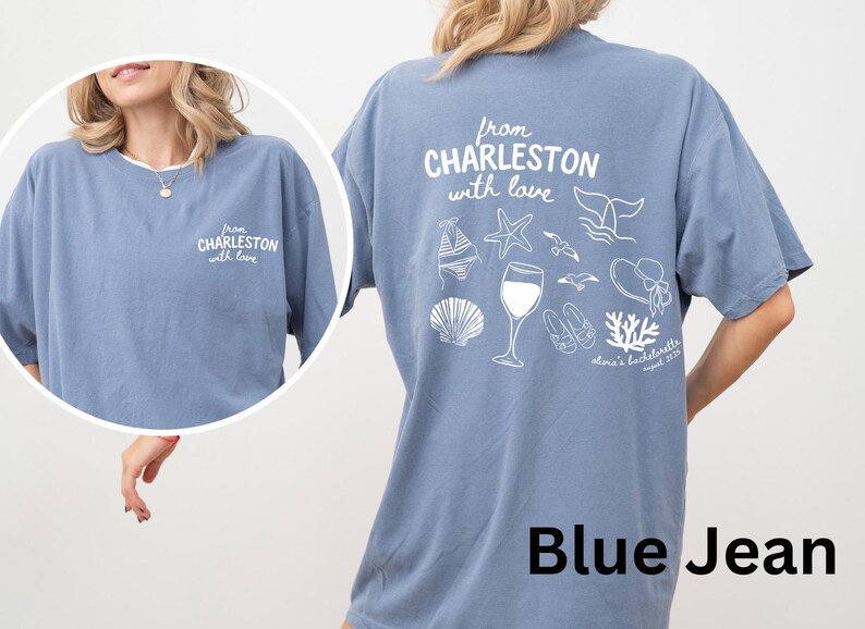 May include: A blue jean colored t-shirt featuring white screen-printed graphics. The front displays the text 'from CHARLESTON with love'. The back features the same text above illustrations of a bikini, starfish, whale tail, wine glass, seagulls, sandals, sun hat, seashell, and coral, with 'olivia's bachelorette august 2025' printed below.