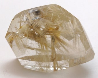 Less than 2.00 per carat!   Faceted Rutilated Quartz Free form  284ct  2" x 1.5" x 1"