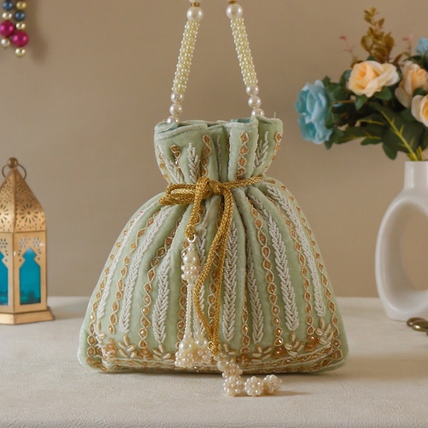 Pistachio Green Ethnic wear potli bag, handbag with, drawstring, Sequin work and Designer Pattern for Formal Wedding and exotic function.