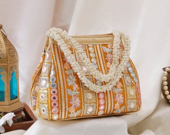 Orange Pastel Potli handbag, bag with Pearl handle and Raw silk fabric for Wedding, Evening Party, Ethnic wear and gifting.