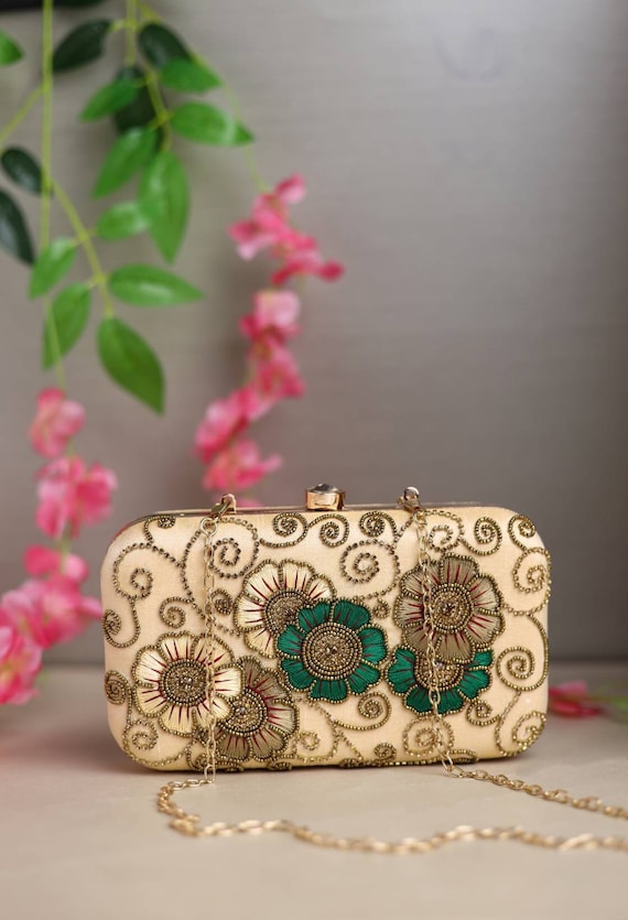 Designer clutch best sale with hand strap