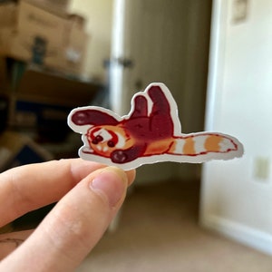 Ondersteboven rode panda glanzende sticker voor laptop, telefoon, iPad-hoesje, toetsenbord, boeken