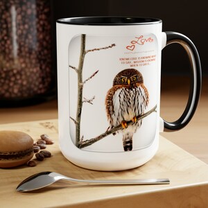 May include: White ceramic mug with a black handle. The mug features a brown and white owl perched on a branch with the text "Love" and "Knowledge is knowing what to say. Wisdom is knowing when to say it." printed on the mug.