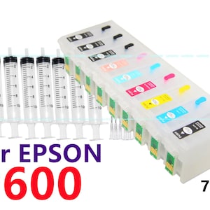 May include: A set of six clear plastic ink cartridges for an Epson P600 printer. The cartridges are labeled with the colors cyan, magenta, yellow, black, light cyan, and light magenta. The cartridges are packaged in a clear plastic box with a label that says "760". The set also includes 12 clear plastic syringes.