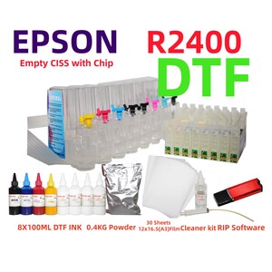 May include: An Epson R2400 DTF empty CISS with chip, eight 100ml bottles of DTF ink, 0.4kg of powder, 30 sheets of 12x16.5 inch A3 film, a cleaner kit, and a USB drive containing RIP software. The system features clear ink tanks with colored valves.