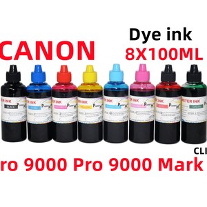 May include: Eight 100 ml bottles of dye ink for Canon Pro 9000 and Pro 9000 Mark II printers. The bottles are labeled with the colors black, cyan, magenta, yellow, light cyan, light magenta, red, and green.