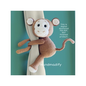 May include: A brown and white crocheted monkey curtain tieback with black eyes. The text reads: This is digital download file PDF, NOT finished product. Handmadify. The monkey has a round head, small ears, and a long tail wrapped around a curtain.
