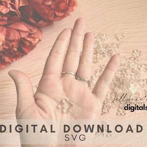 May include: A digital download SVG file for a hand-drawn design of a snowflake. The image shows a hand holding a few clear plastic snowflakes on a pink background.