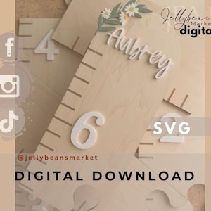 May include: Wooden growth chart with the name "Aubrey" in white script, decorated with a floral accent. The chart features white numbers and measurement markings. The text "DIGITAL DOWNLOAD" is visible.