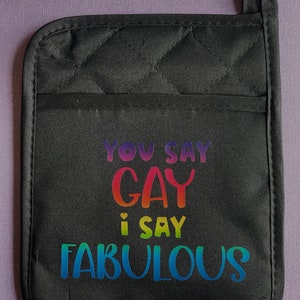 May include: Black quilted oven mitt with a rainbow design that says "You say gay I say fabulous".