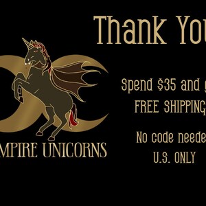 May include: A black graphic featuring a gold crescent moon symbol behind a dark unicorn with bat-like wings and red accents. The text reads: Thank You! Spend $35 and get FREE SHIPPING! No code needed U.S. ONLY. VAMPIRE UNICORNS is written below.